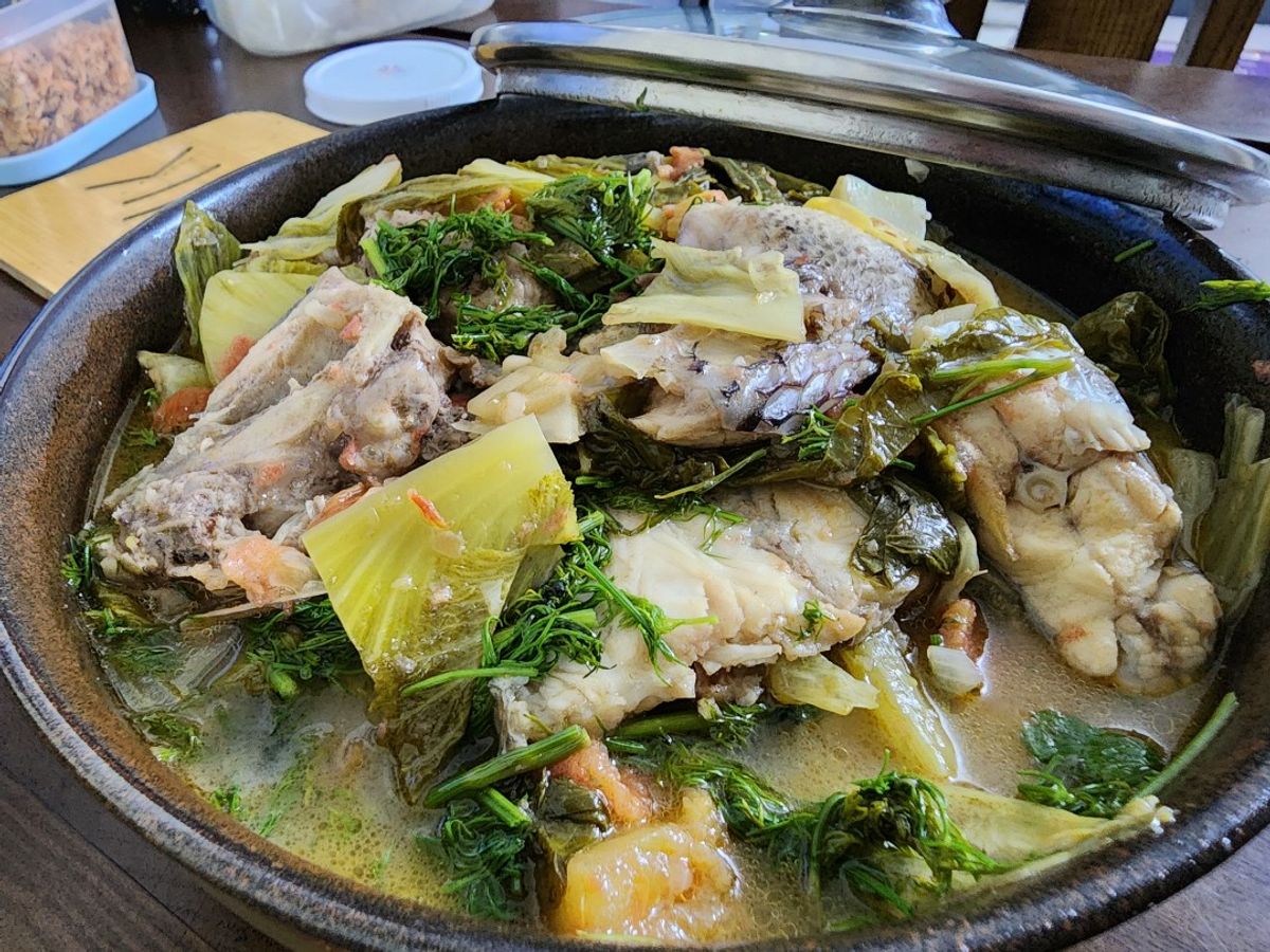 Đầu xương cá rô phi om dưa